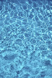 Wavy Water Surface Prints: Wavy blue water surface with reflections