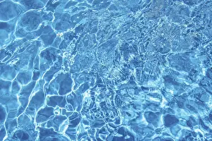 Wavy Blue Water Prints: Wavy blue water surface with reflections