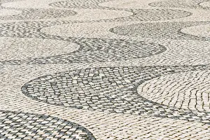 Deserted Portuguese Streets Prints: Wavy pattern in pavement, black and white