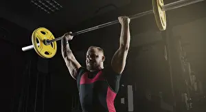 Weight Training Routine Prints: Weightlifter does an exercise with a barbell