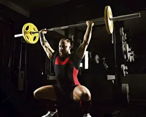 Caucasian Male Athlete Prints: Weightlifter does an exercise with a barbell