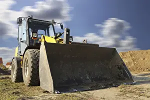 Construction Site Germany Prints: Wheel loader at sunset, here in the RingstraBe development area (Mutterstadt)