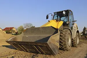 Construction Site Germany Prints: Wheel loader at sunset, here in the RingstraBe development area (Mutterstadt)