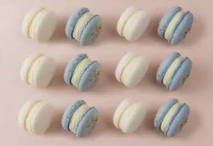 Baked Goods On A Table Prints: White and blue macaroons on the table