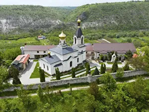 Prints of White church with gold domes and surrounding buildings on a green hill, aerial view, St Moldova Prints: White Church Print, Orheiul Vechi, Moldova