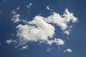 Cloud Formations Germany Prints: White clouds against a blue sky