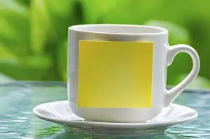 Empty Notepad Prints: White cup with empty sticky notepad