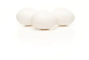 White Studio Setup Prints: Three white eggs isolated on a white background