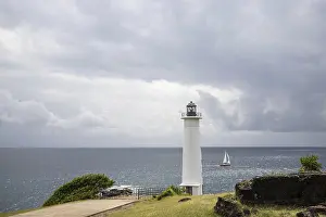 Prints of White lighthouse on a steep coast. Dramatic clouds with a view of the sea, pure Caribbean at Le Phare du Vieux-Fort, on Guadeloupe, French Antilles, France Guadeloupe Prints: White Lighthouse Print: Guadeloupe, French Antilles