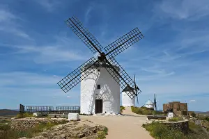 Spanish Countryside Photography Prints: White windmill in front of a blue sky with few clouds
