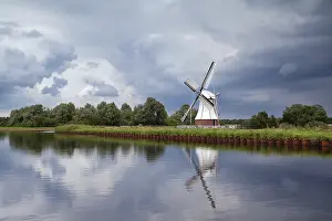 Benelux Tourist Attraction Image Prints: White windmill over clouded sky, Netherlands