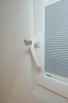 Central European Building Sites Prints: Detail of a white window handle with integrated blind