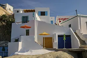 Whitewashed Buildings Greece Prints: Whitewashed buildings with colored doors and umbrellas