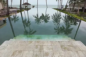 Indian Ocean Coastline Prints: Wide marble steps go down in pool