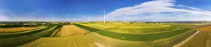 Alternative Energy Source Europe Prints: Wind farm between grainfields, panorama