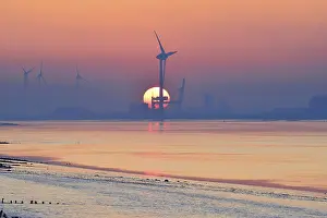 Wind Turbines In Germany Prints: Wind turbines in front of setting sun