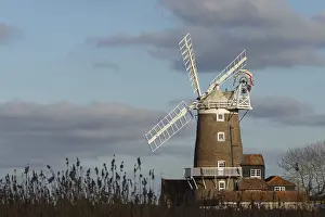 White Clouds England Prints: Windmill with a blue sky and white clouds behind
