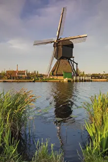 Prints of Windmill on the canal, Kinderdijk, UNESCO World Heritage Site, Zuid-Holland, Netherlands Heritage Site Prints: Kinderdijk Windmill Print, Netherlands