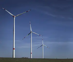 Empty Farm Fields Prints: Windmill in the field, three windmills with cleared sky