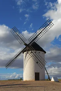 Overcast Sky Travel Photos Prints: A windmill in front of an impressive sky full of clouds