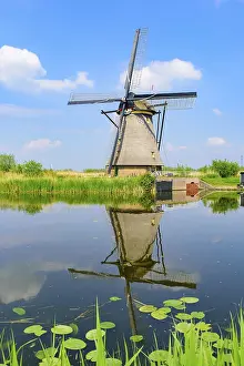 Prints of The windmills and the reflection on water in Kinderdijk, a UNESCO World Heritage site in Rotterdam, Netherlands Heritage Site Prints: The Windmills and Reflection in Kinderdijk Print