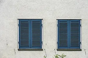 German House Exterior Prints: Two windows with closed shutters