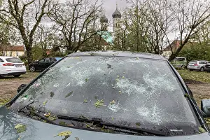 Severe Weather In Southern Germany Prints: Windscreen of a car destroyed by hail