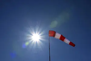 Bavaria Weather Forecast Prints: Windsock with sun star against light