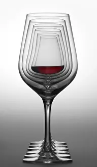 Red Wine Glass Prints: Some wine glasses standing consecutive in a row in gradient grey back