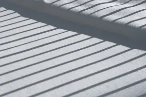 Daytime Winter Landscape Photo Prints: Winter impression, fence casting a shadow on snow