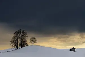 Snowy Countryside Scenery Prints: Winter landscape against a dramatic sky