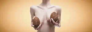 Cosmetic Healthcare System Prints: Woman posing in the studio with coconuts in her hands