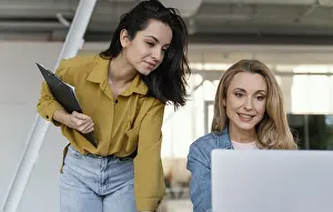 Business Teamwork Prints: Women checking work project together