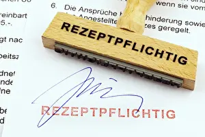 Wooden Stamp Prints: A wooden stamp is placed on a document