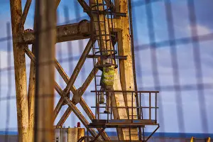 Alpine Sport Tourism Prints: Worker climbing on a crane