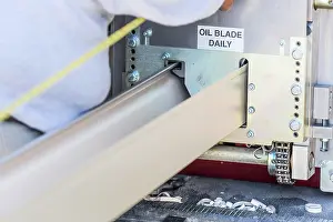 Rain Gutter Installation Prints: Worker Measuring Rain Gutter Processing Through Seamless Shaping Machine