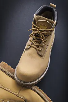 Text Free Space For Sale Prints: Working boots on black background