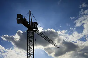 Architectural Style Photography Prints: Working crane on cloudy sky