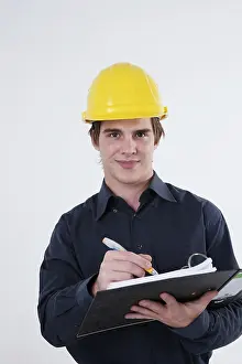 Male Architect Prints: Young architect with a hard hat