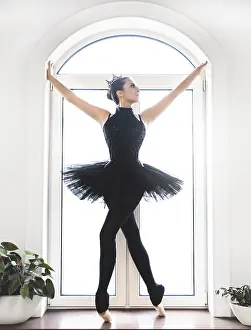 Female Ballet Dancer Prints: Young ballet dancer practicing before performance in black tutu