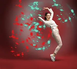 Beautiful Female Dancer Pose Prints: Young and beautiful dancer posing in the studio in front of a colourful background