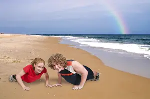 Couple Exercising Together Prints: Young couple exercising by doing pushups together