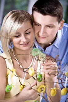 Caucasian Family Photos Prints: Young couple looking at Easter decorations