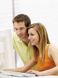 Online Communication Prints: Young couple using a computer