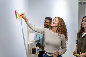 Young Professionals Working Together Prints: Young diverse team collaborating on a project