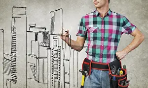 Young Construction Worker Prints: Young man builder with ruler in hands draw construction model