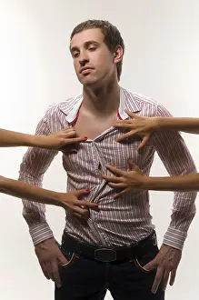 Man Looking At Camera Prints: Young man on an isolated background in studio