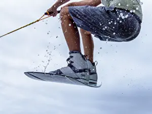 Water Sports Activities Prints: Young man jumping with wakeboard