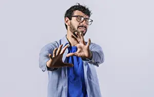 Stressed Young Adult Prints: Young man with rejection expression isolated