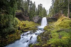 Motion Blur Waterfalls Prints: Young man in front of waterfall